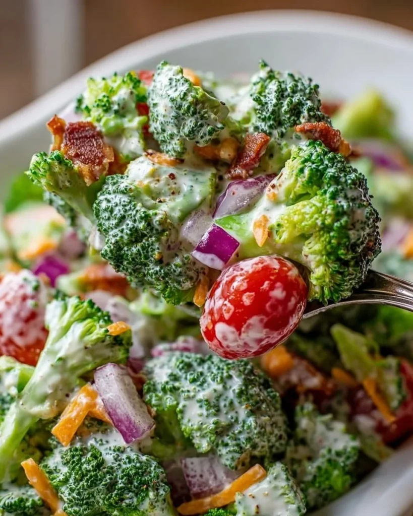 Bowl of delicious broccoli ranch salad with fresh vegetables and creamy dressing