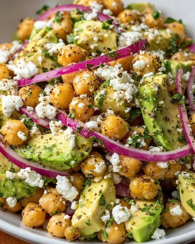 Chickpea Feta Avocado Salad with fresh ingredients in a bowl