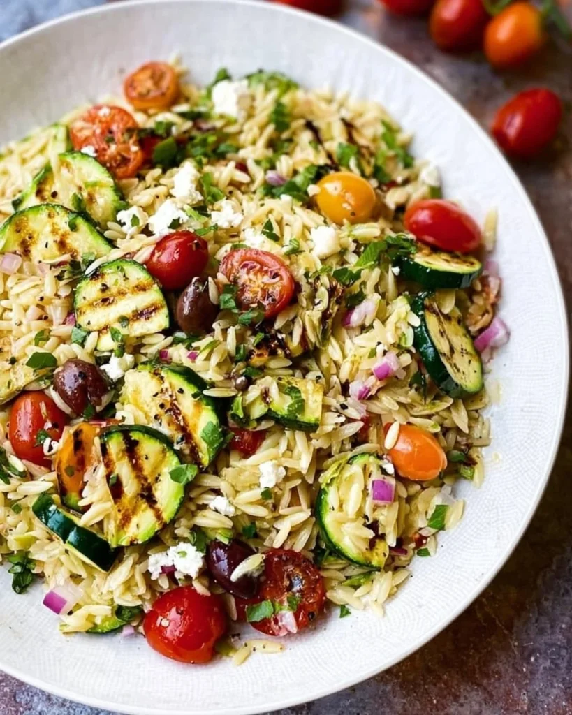 Colorful Greek Orzo Salad with Grilled Zucchini and fresh vegetables