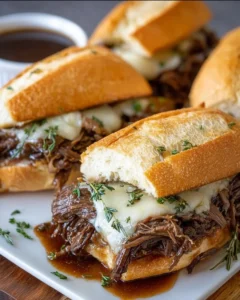 Delicious Crockpot French dip sandwiches served with au jus