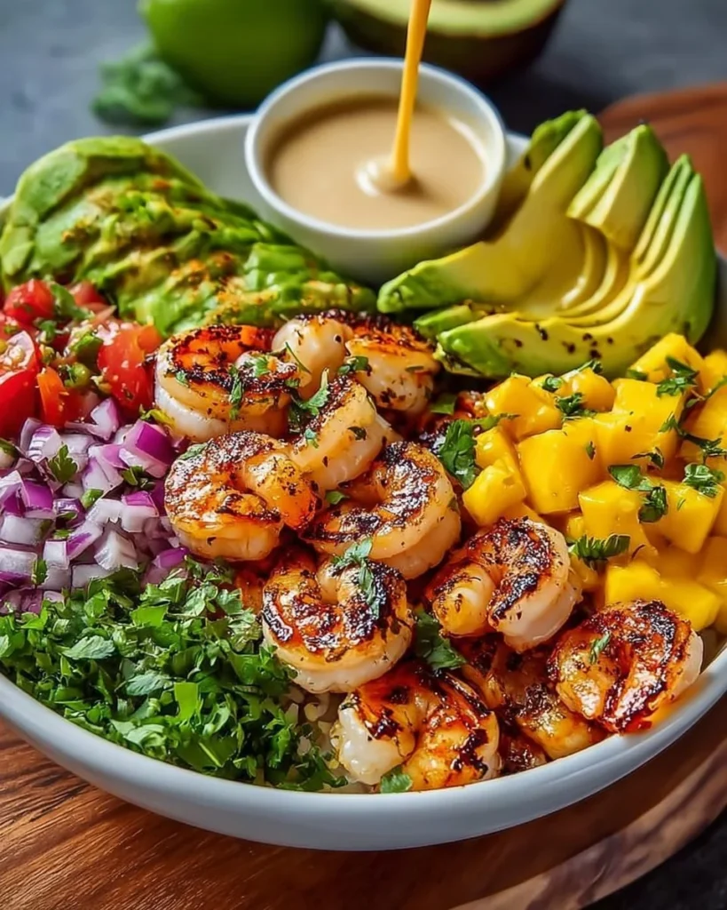 Shrimp avocado bowl with mango salsa and lime-chili sauce